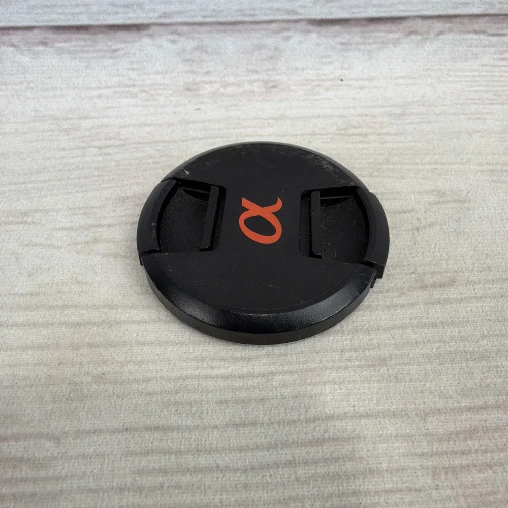 SONY ALPHA 55mm LENS FRONT COVER Black Genuine